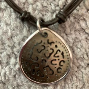 Retired Silpada Sterling Silver carved lip shell leather corded necklace